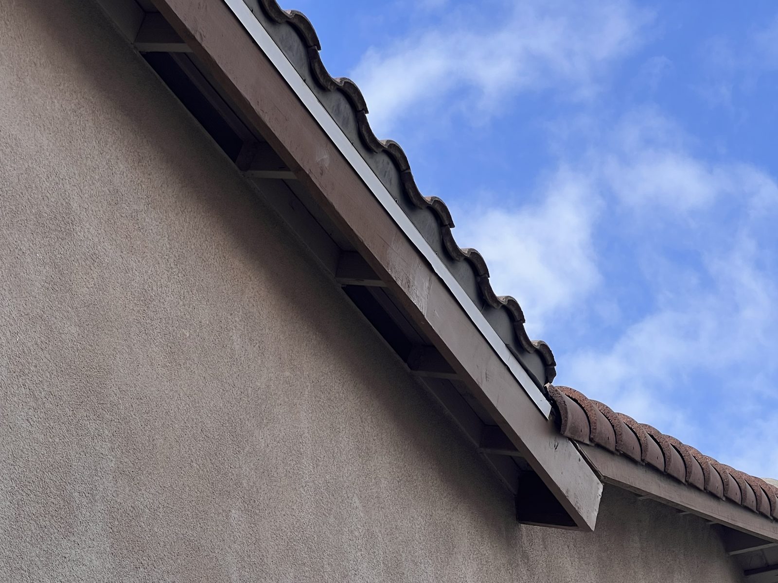 New fascia the full length of the eave, cut and fitted before paint.